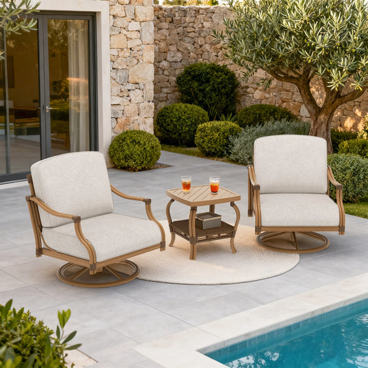 Two white chairs with wooden frames on a patio by a poolside, with a small table between them.