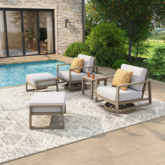 Outdoor patio set with chairs, ottomans, and a table by a poolside.