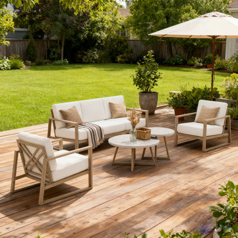 Outdoor patio set with furniture and plants on a wooden deck