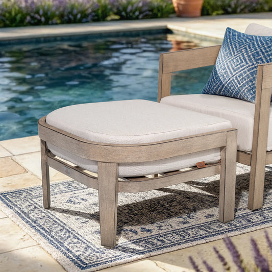 Outdoor furniture set with cushions by a poolside