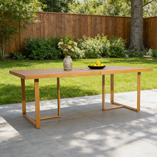 Outdoor table with a vase and fruit bowl on a patio