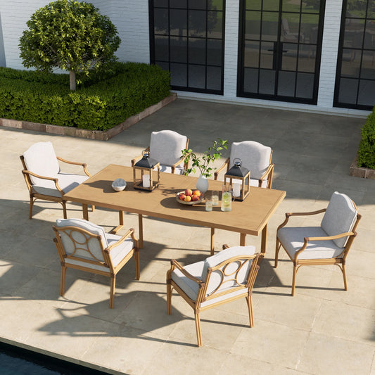 Outdoor patio set with wooden table and chairs on a patio.