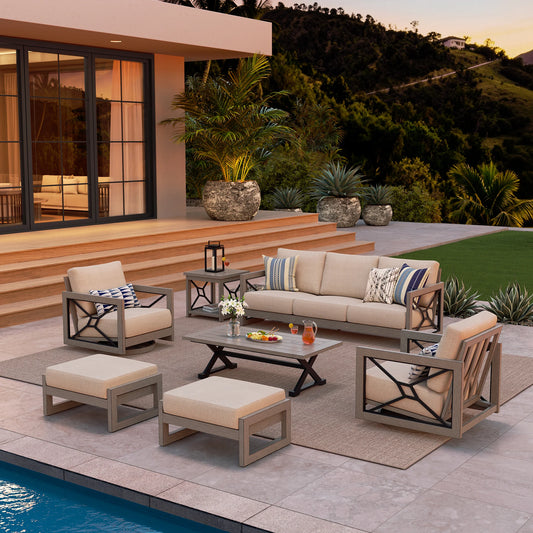 Outdoor patio set with furniture and decor by a poolside.