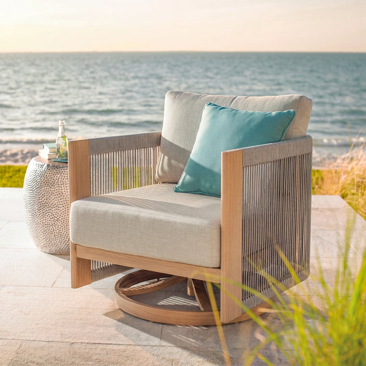 Outdoor chair with a blue pillow by the sea