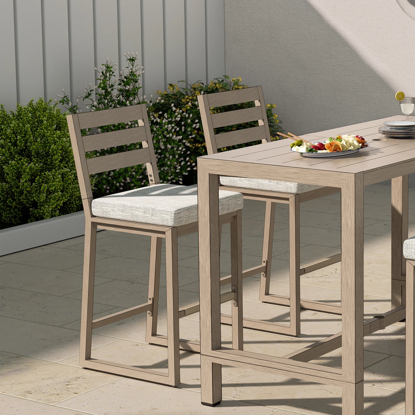 Outdoor dining set with wooden table and chairs on a patio.