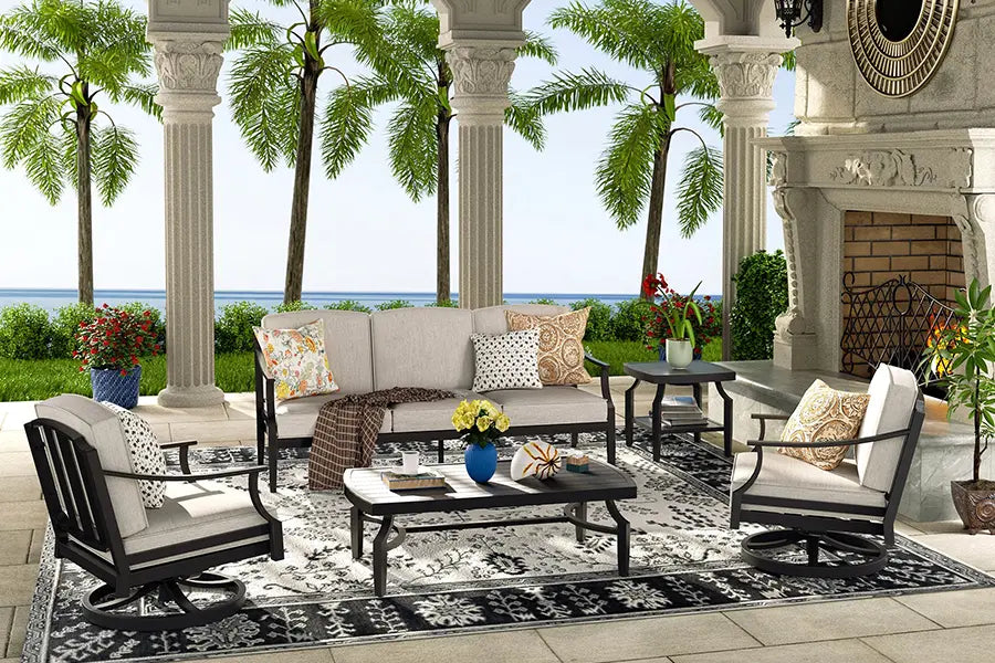 Outdoor patio set with furniture and decor in a tropical setting.