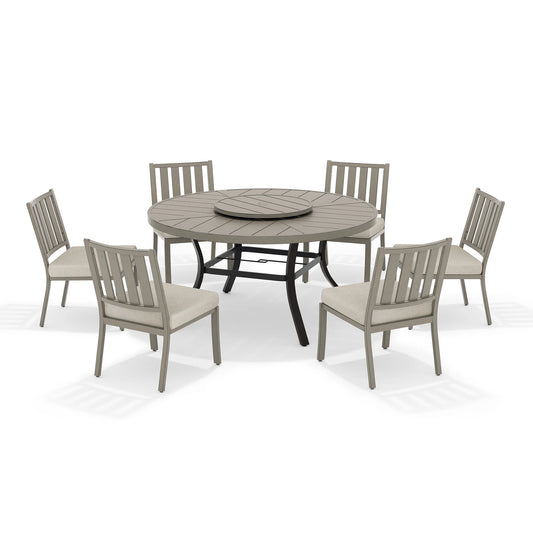 Round outdoor dining table with six armless chairs