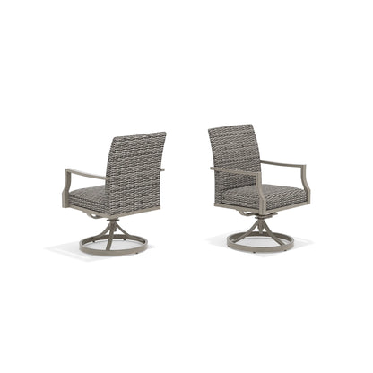 Two gray wicker outdoor chairs with metal swivel bases 