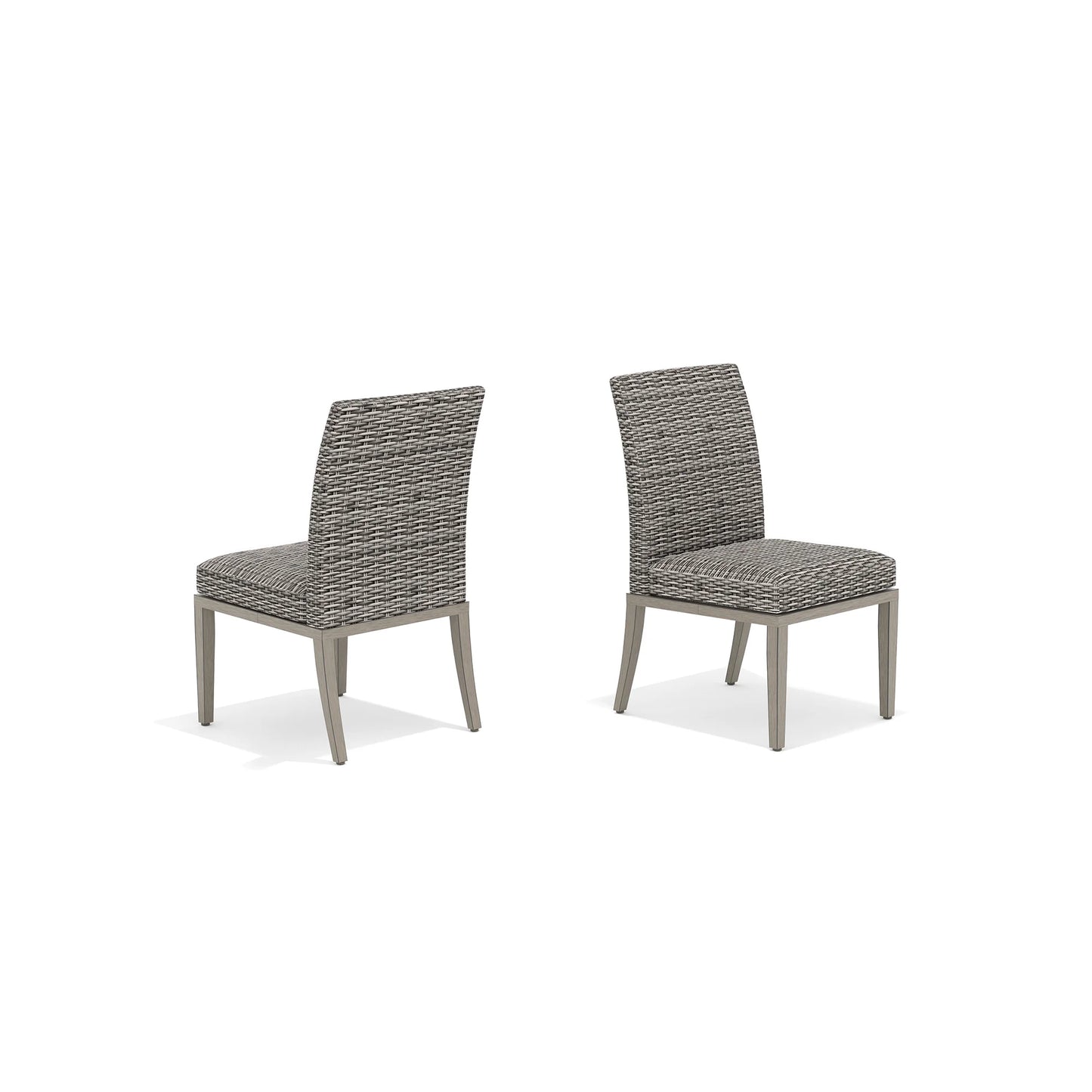 Two gray wicker chairs with cushions 
