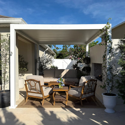 Outdoor patio area with wooden furniture and a white pergola.