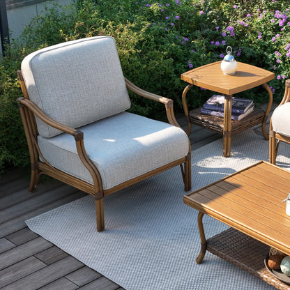 Outdoor furniture set with a chair, table, and side table on a wooden deck.
