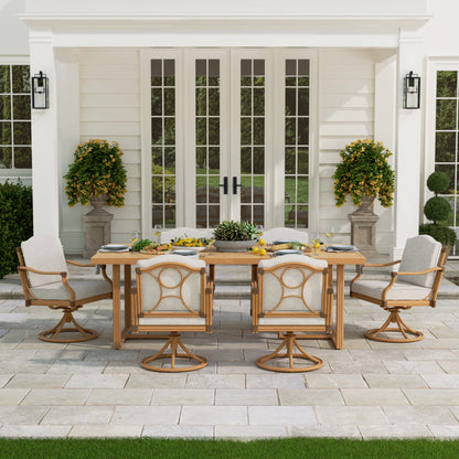 Outdoor dining set with wooden table and chairs on a patio in front of a house.