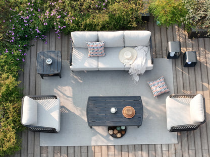 Outdoor patio set with furniture and decor on a wooden deck