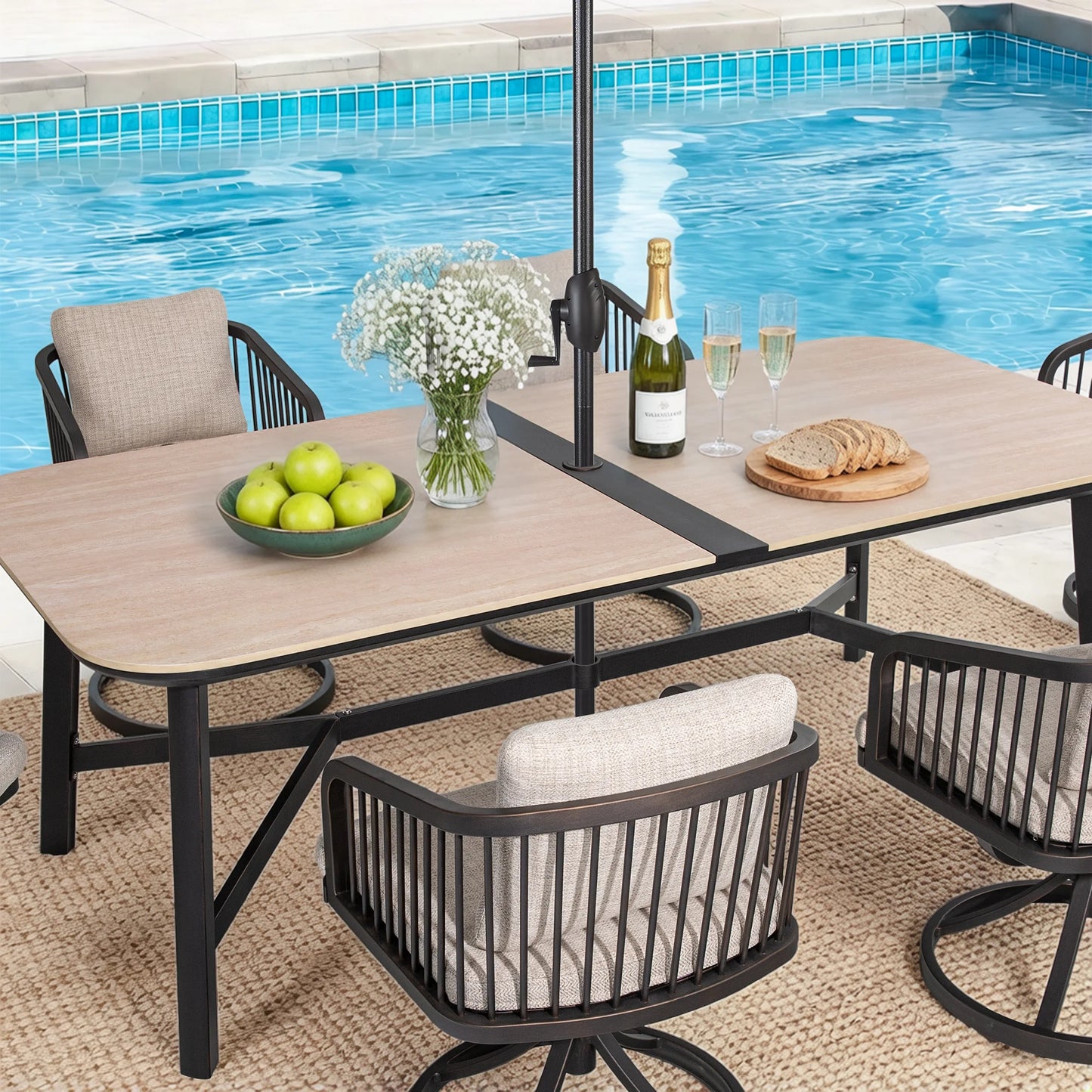 Outdoor patio table set with chairs by a pool