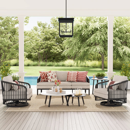 Outdoor patio set with furniture and decor on a wooden deck.