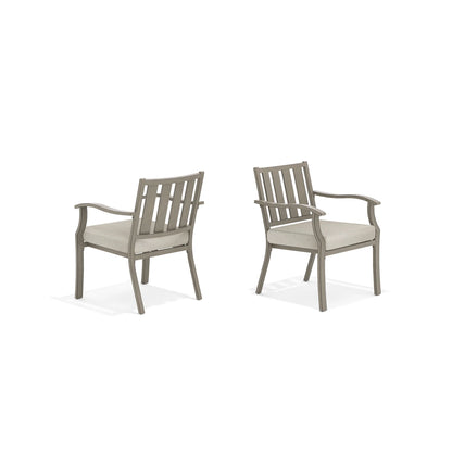 Two gray chairs with beige cushions 