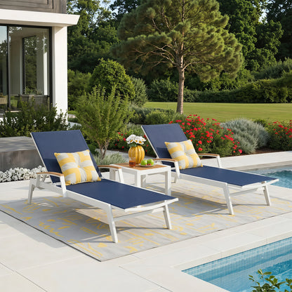 Canyon outdoor chaise lounge set beside swimming pool, minimalist aluminum sun loungers with Phifertex sling fabric and teak side table, modern coastal backyard patio
