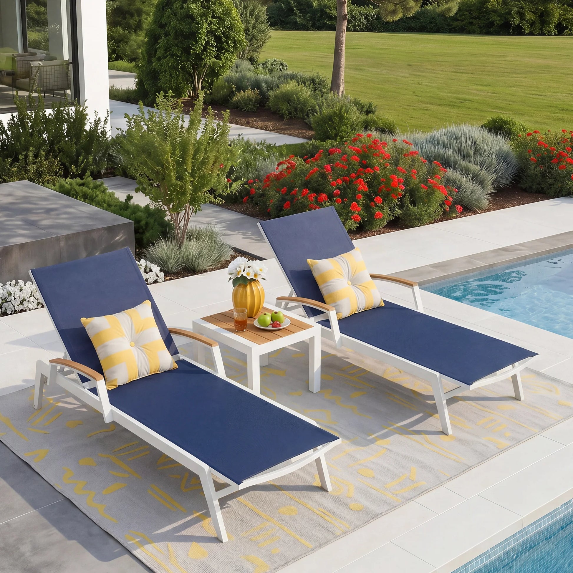 Canyon outdoor chaise lounge set beside swimming pool, minimalist aluminum sun loungers with Phifertex sling fabric and teak side table, modern coastal backyard patio