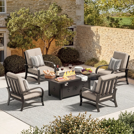 Outdoor patio set with chairs, table, and fire pit on a stone patio.