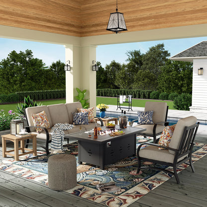 Outdoor patio setup with furniture, fire pit, and decorative elements on a wooden deck.