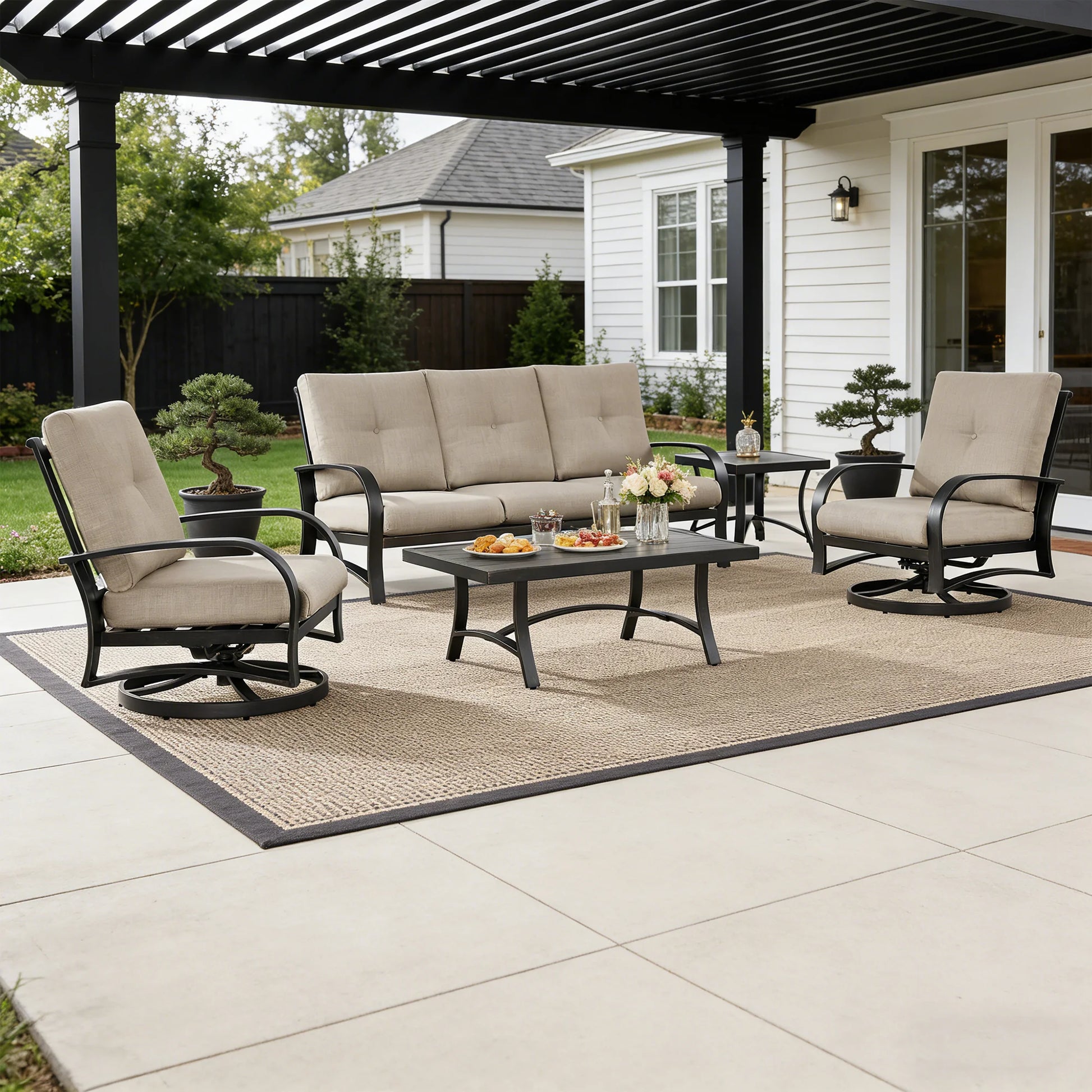 Outdoor patio set with furniture and table on a patio area.