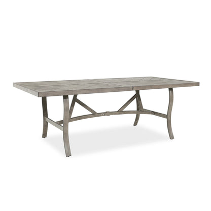 Rectangular outdoor dining table with a rustic finish 