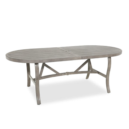 Oval outdoor dining table with a rustic finish 