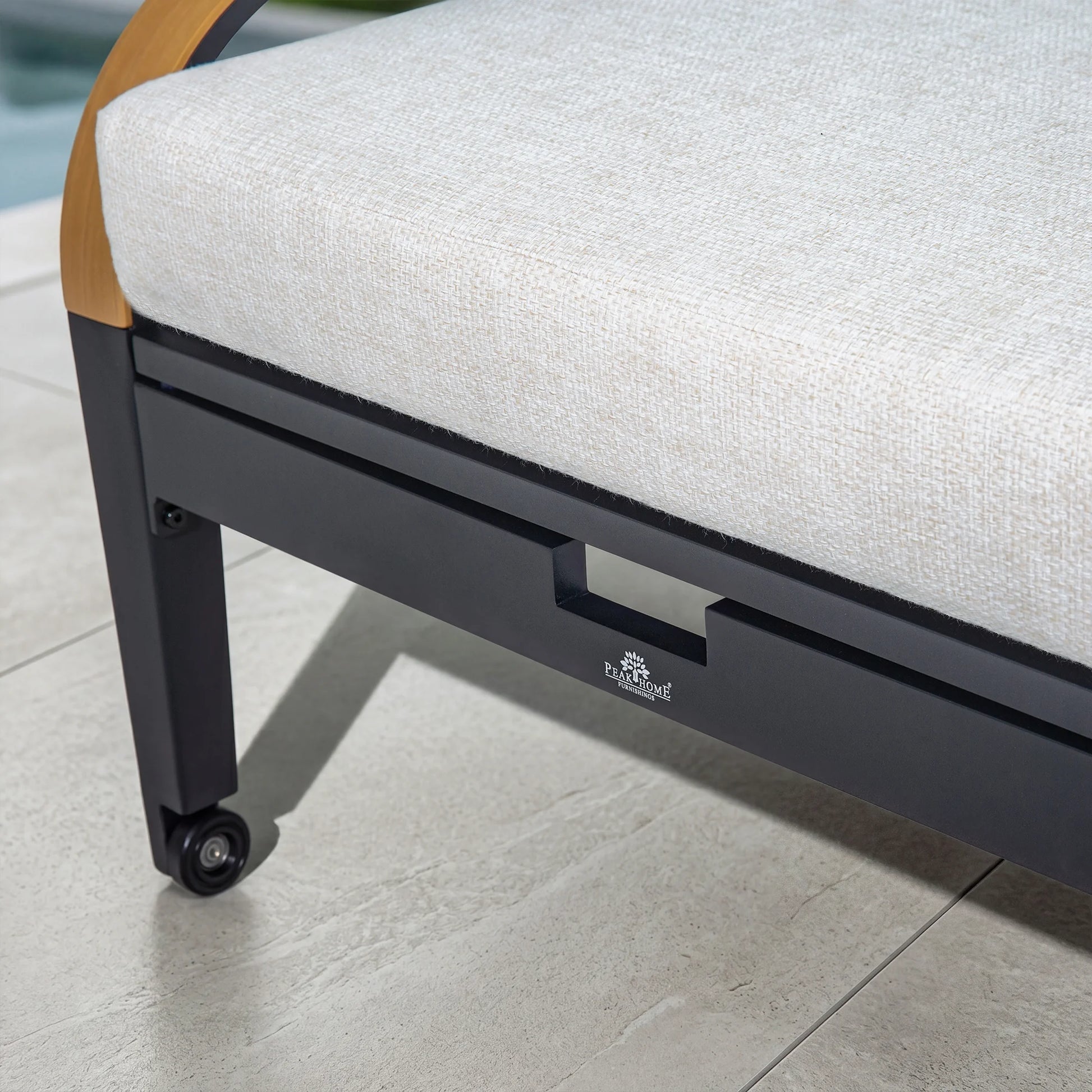 Close-up of a chair with a visible brand logo on a tiled floor.