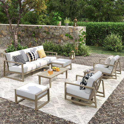 Outdoor patio set with furniture and decor in a garden setting