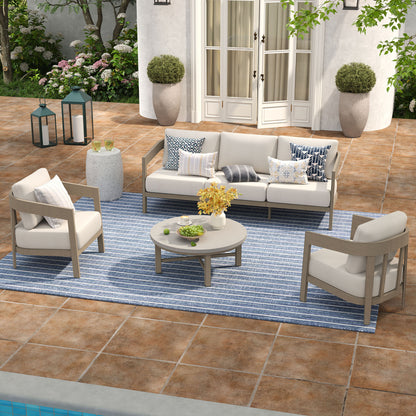 Outdoor patio set with furniture and decor on a tiled patio.