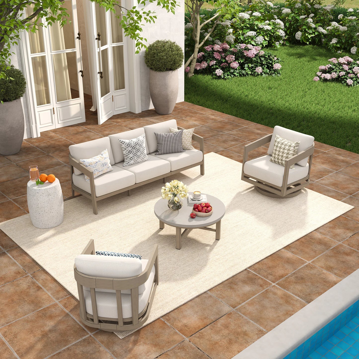 Outdoor patio set with furniture and decor on a patio area.