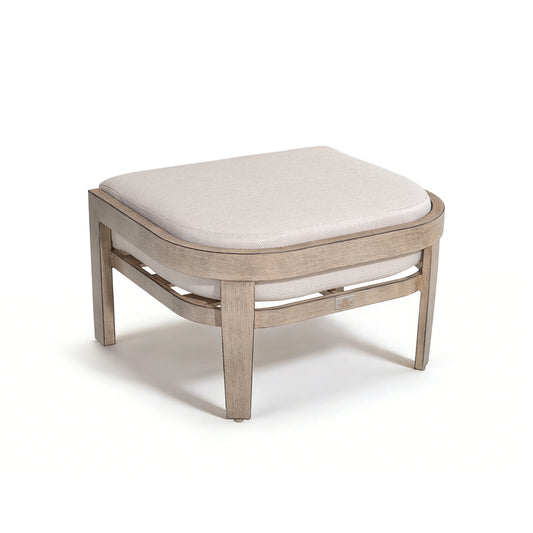 Wooden ottoman with a white cushion on a white background