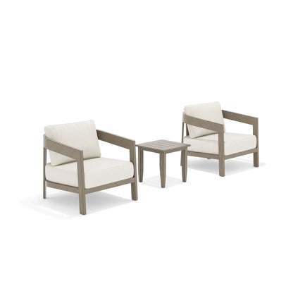 Two wooden armchairs with light beige cushions and a matching side table 