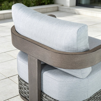 Close-up of the elegant curved backrest showing the hand-brushed wood-grain finish on the aluminum frame.
