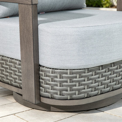 Detailed close-up of the multi-tonal gray PE wicker base and thick patio seat cushion of the club chair.
