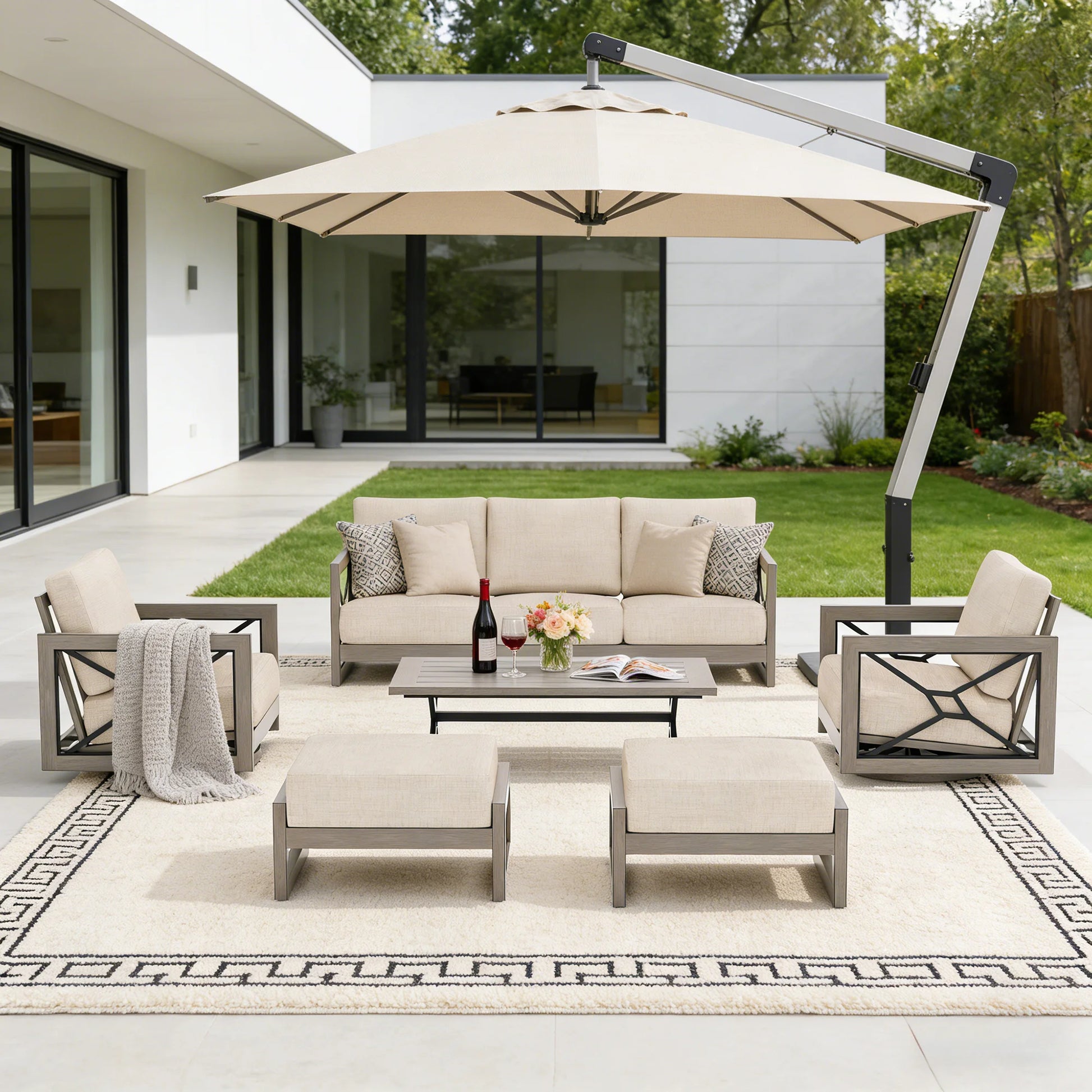 Outdoor patio set with furniture and umbrella on a patio area.