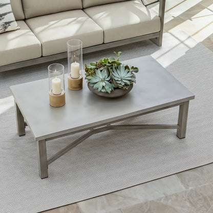 Outdoor coffee table with decorative items on a patio