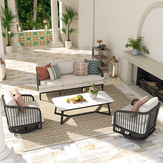 Outdoor patio furniture set with cushions in a sunlit room.