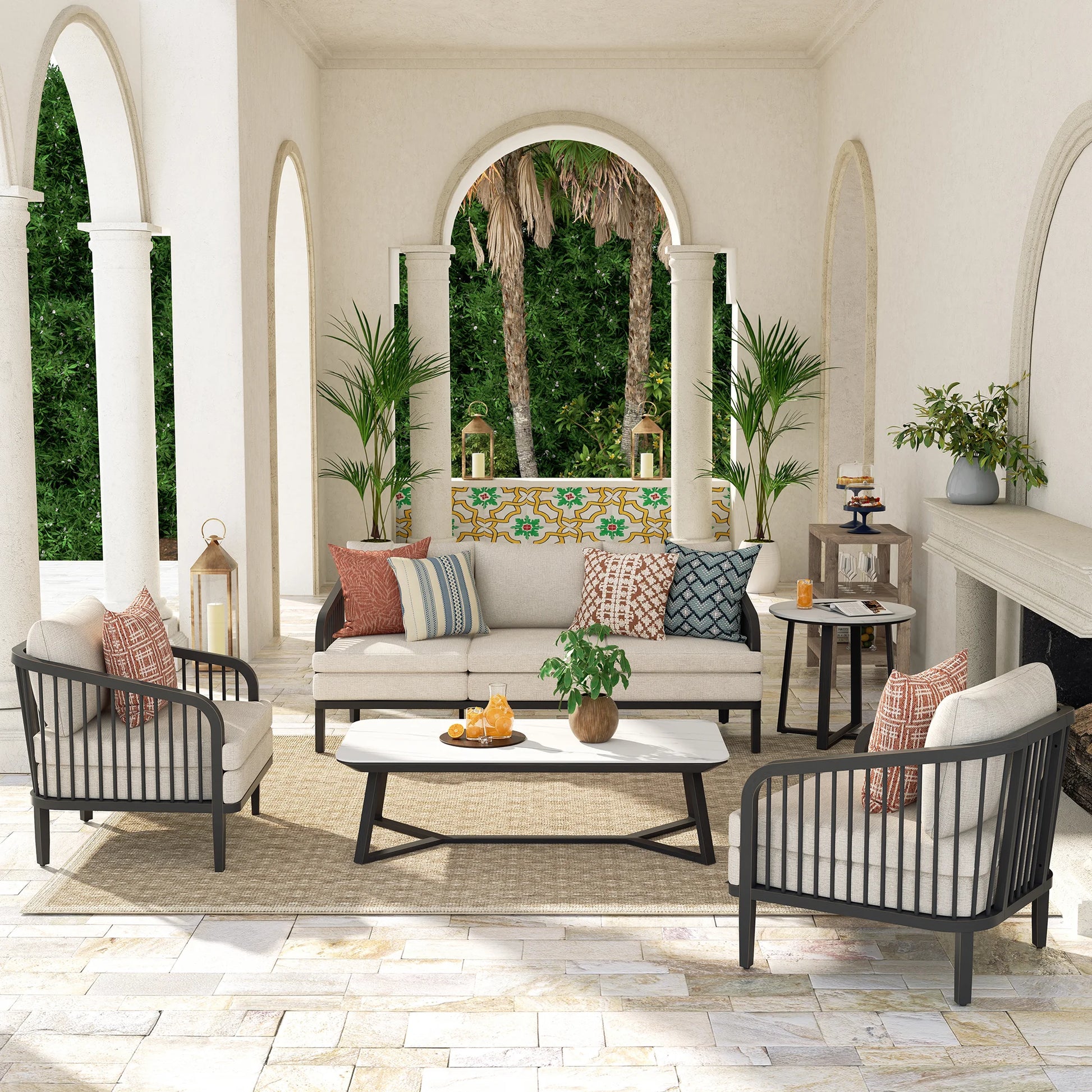Outdoor patio set with furniture and decor in a sunroom.