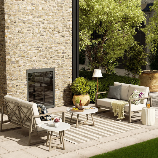 Outdoor patio with stone wall, furniture, and decorative elements