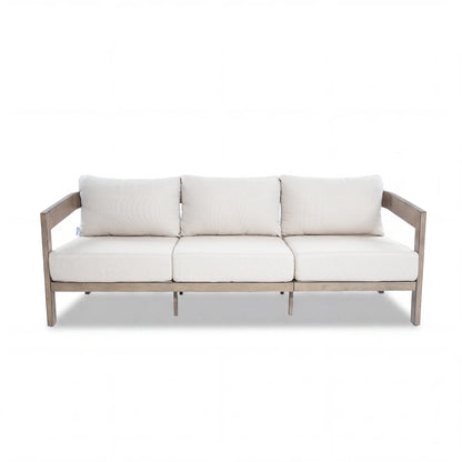 Modern outdoor sofa with white cushions on a white background
