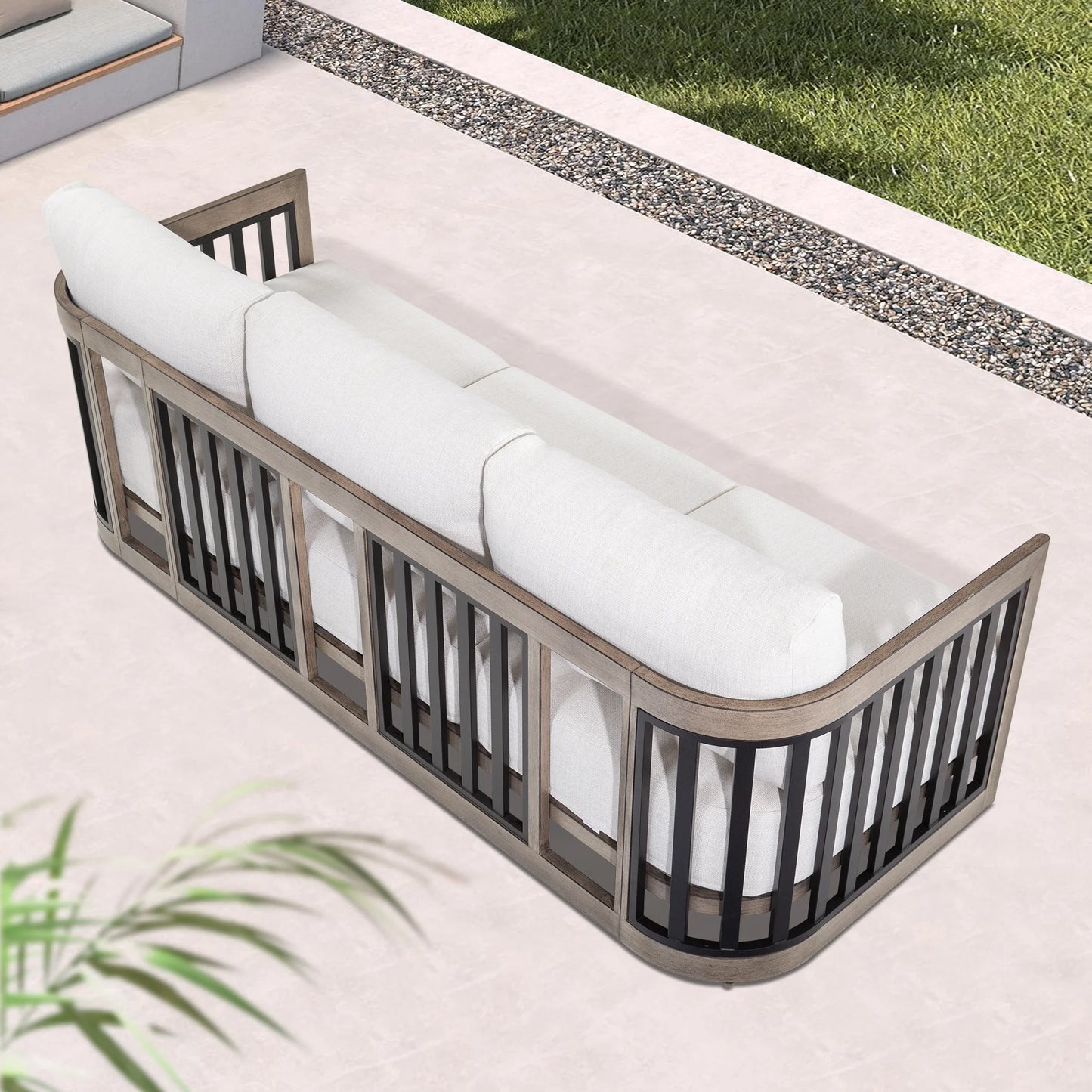 Outdoor bench with white cushions on a patio
