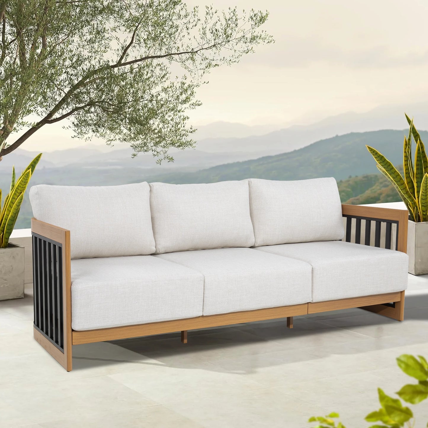 White outdoor sofa with wooden frame in a garden setting