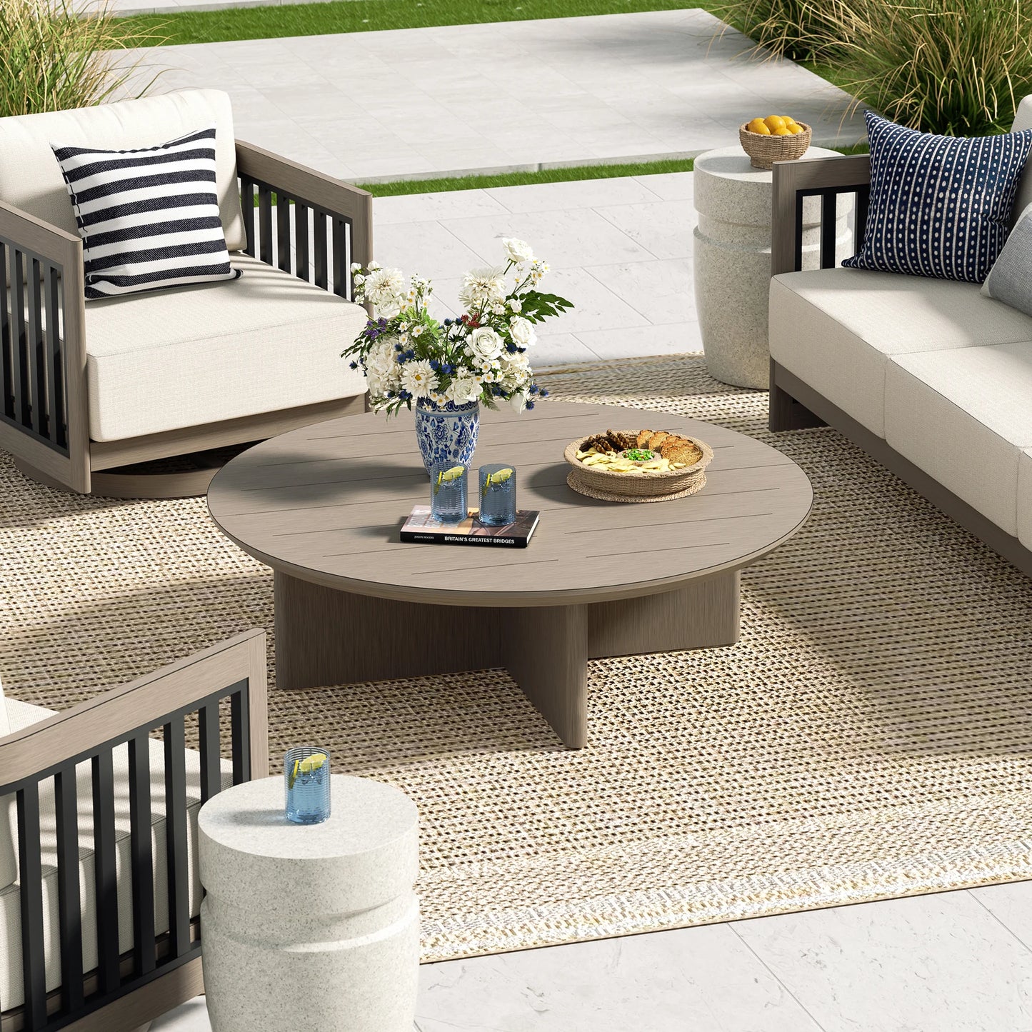 Outdoor patio setting with furniture, table, and decorative items on a patio.