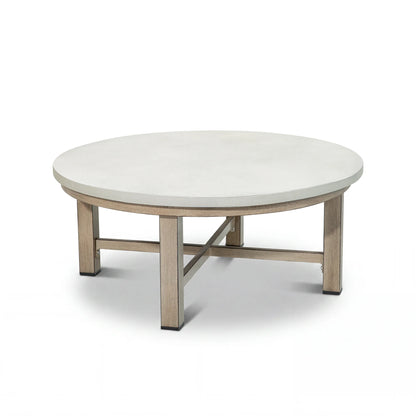 Round coffee table with a white top and wood-look legs on a white background