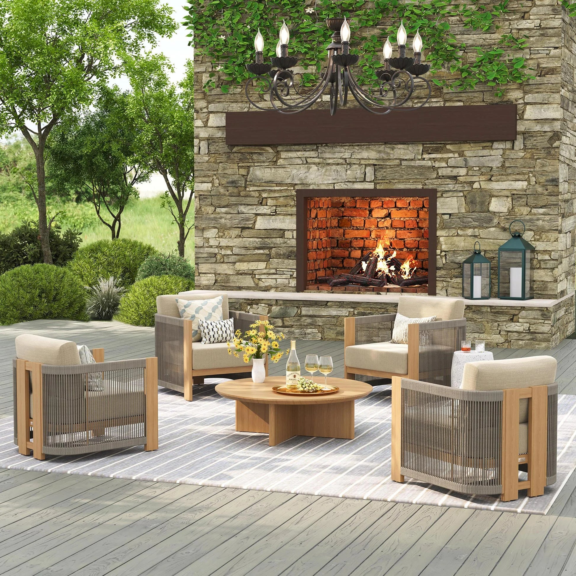 Outdoor patio setting with stone fireplace, chairs, and a table.