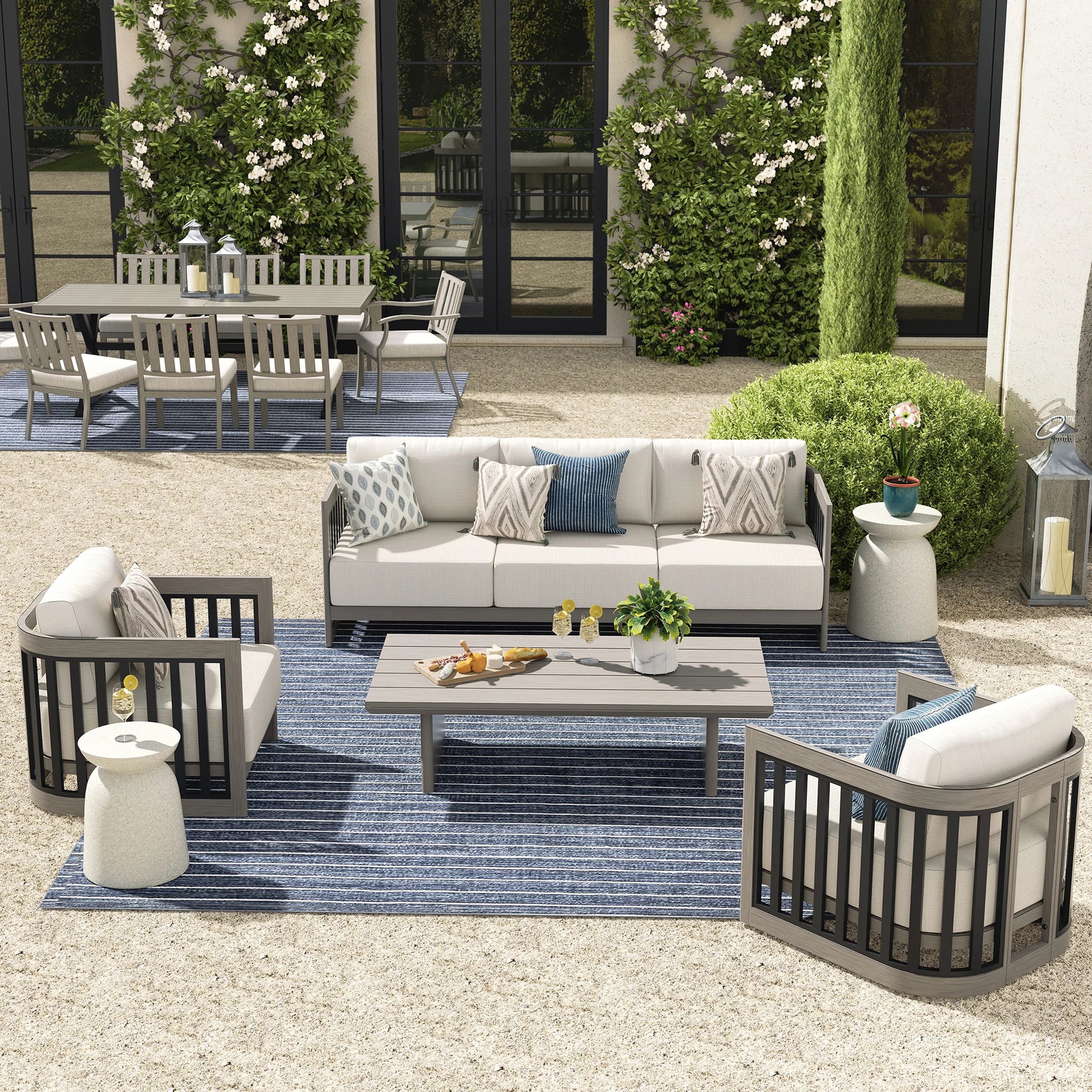 Outdoor patio set with furniture and decor on a patio area.