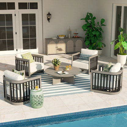 Outdoor patio set with furniture and decor by a pool