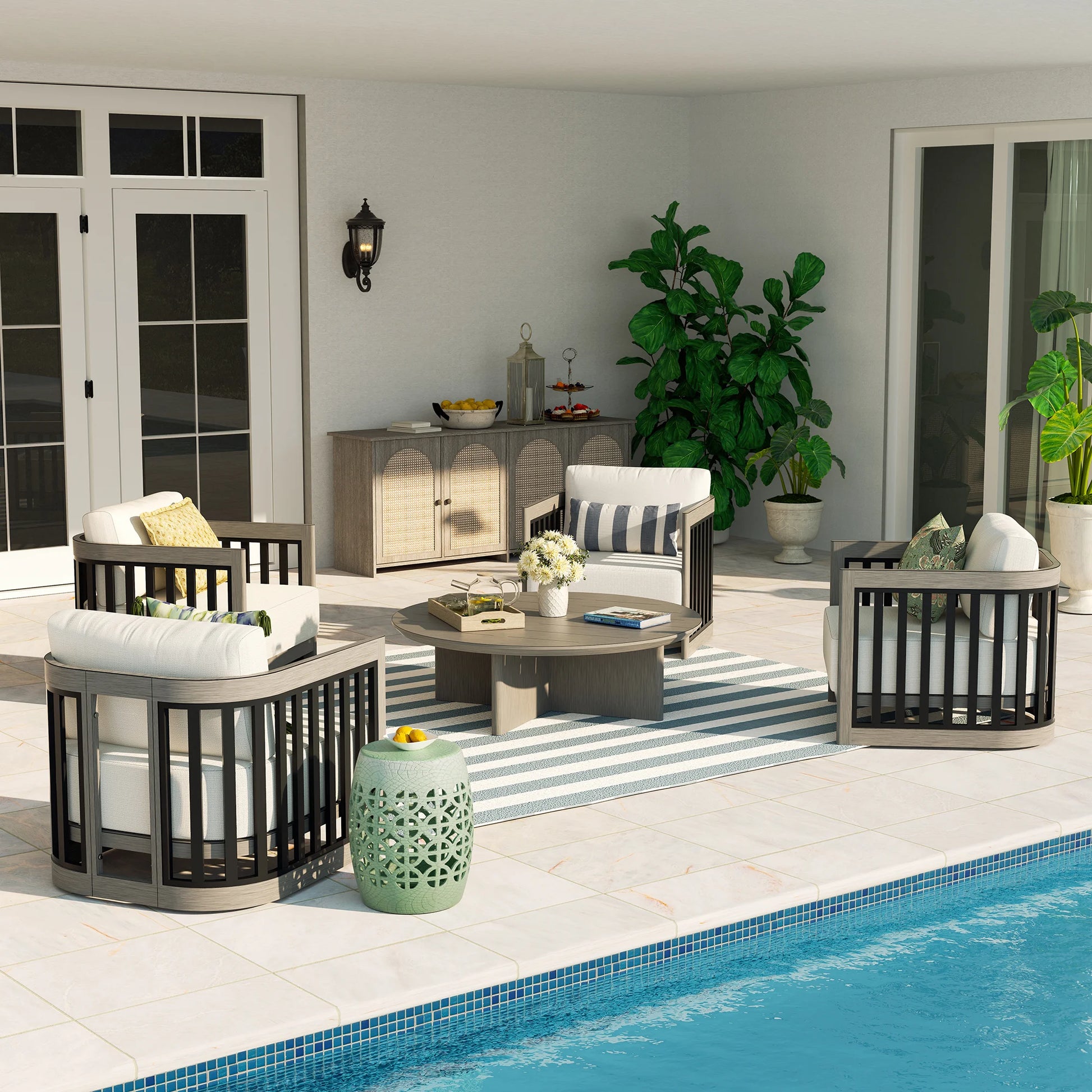 Outdoor patio area with furniture and decor by a pool