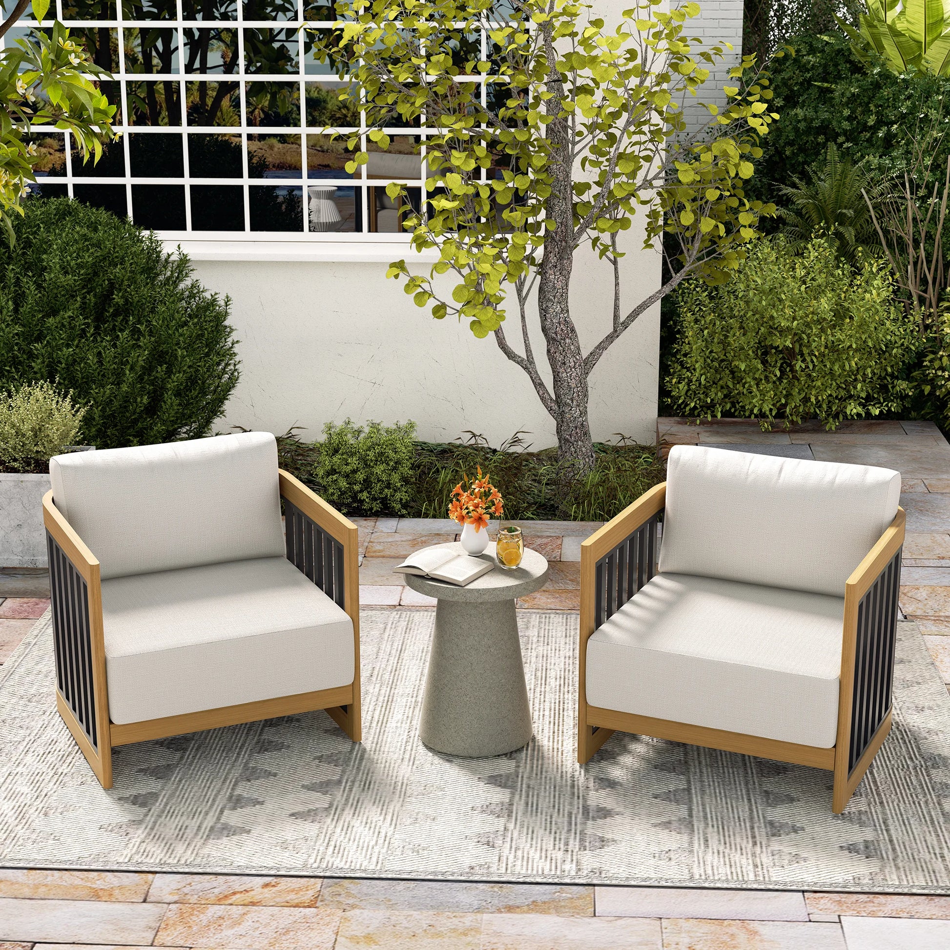 Outdoor patio set with two chairs and a small table on a stone patio.